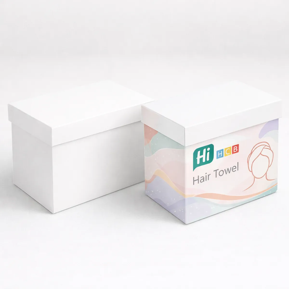 Two rectangular gift boxes with lids- one plain white and one decorated with soft pastel patterns- class=